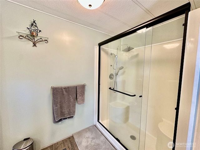 4317 Hamilton Dr, Oak Harbor, WA 98277 - bathroom featuring a shower stall and a textured ceiling
