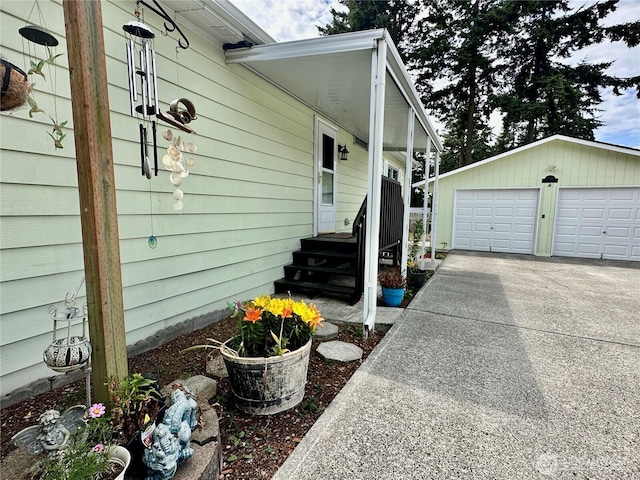 4317 Hamilton Dr, Oak Harbor, WA 98277 - view of property exterior with a detached garage and an outdoor structure