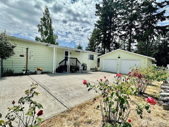 4317 Hamilton Dr, Oak Harbor, WA 98277 - back of house featuring a detached garage and an outdoor structure
