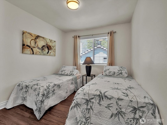 bedroom featuring dark wood-style floors