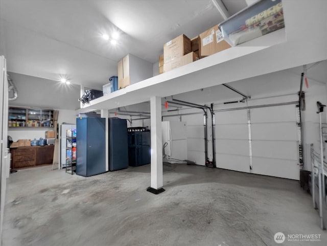garage with freestanding refrigerator