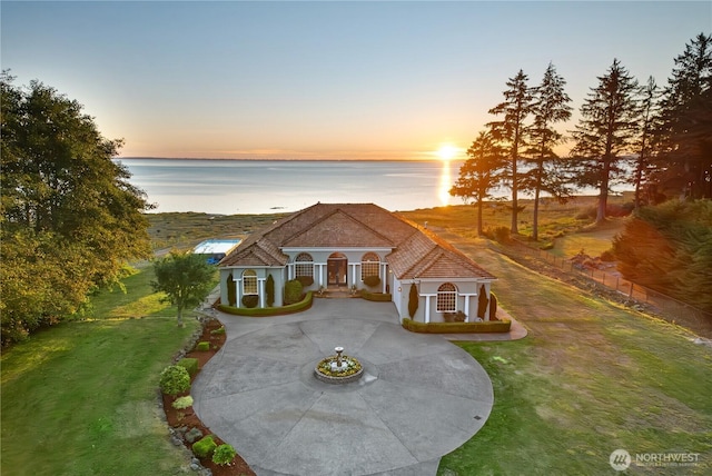 41 Gray Gables Ln, Hoquiam, WA 98550 - view of front of property with a yard, a water view, and curved driveway