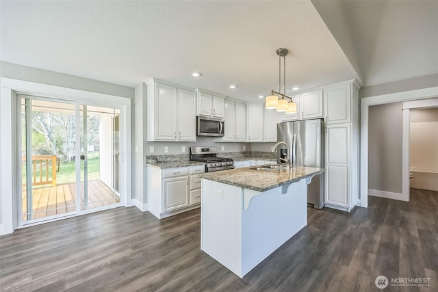 178 Pacific Blvd NW, Ocean Shores, WA 98569 - kitchen featuring stainless steel appliances, baseboards, a sink, and white cabinetry