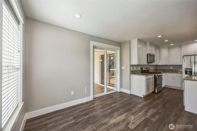 178 Pacific Blvd NW, Ocean Shores, WA 98569 - kitchen featuring baseboards, appliances with stainless steel finishes, dark wood-type flooring, and recessed lighting