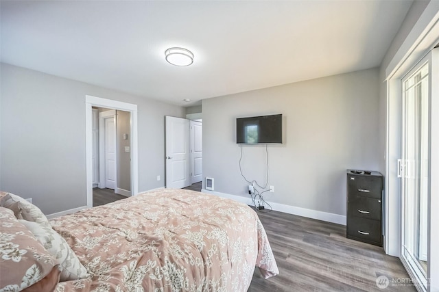 178 Pacific Blvd NW, Ocean Shores, WA 98569 - bedroom featuring baseboards, wood finished floors, and visible vents