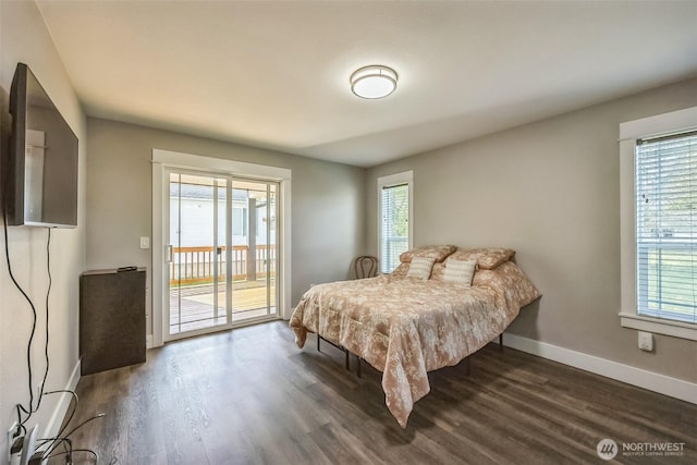 178 Pacific Blvd NW, Ocean Shores, WA 98569 - bedroom featuring wood finished floors, access to exterior, baseboards, and multiple windows