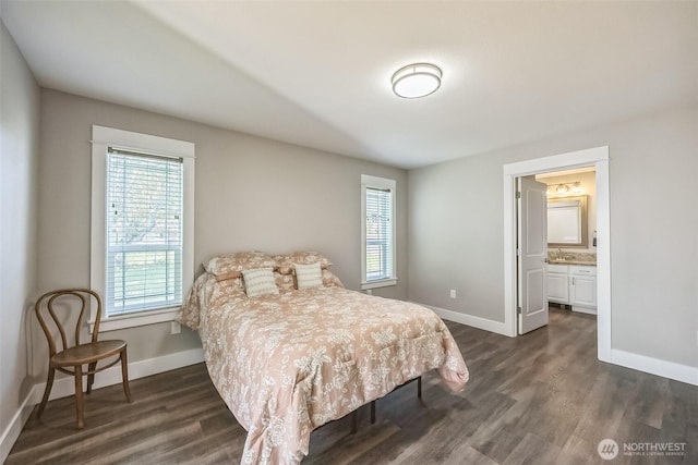 178 Pacific Blvd NW, Ocean Shores, WA 98569 - bedroom featuring baseboards, a sink, dark wood-style floors, and ensuite bathroom