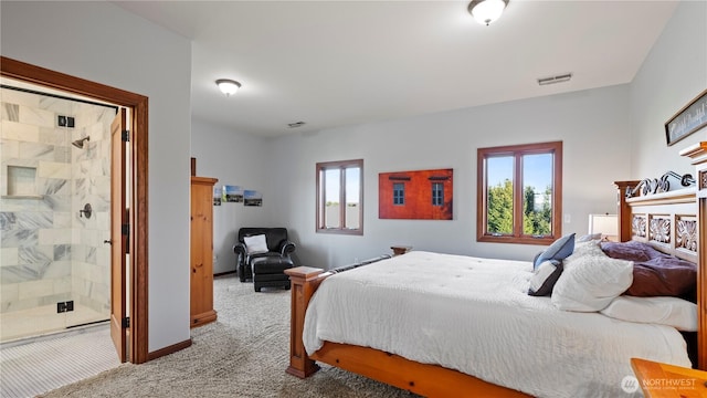 bedroom featuring carpet flooring, baseboards, visible vents, and multiple windows