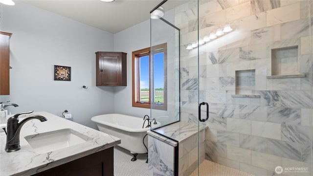 full bath featuring vanity, a soaking tub, and a stall shower