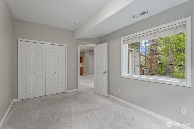 4952 160th Ct SE, Bellevue, WA 98006 - unfurnished bedroom featuring baseboards, a closet, visible vents, and carpet