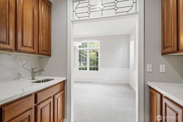 4952 160th Ct SE, Bellevue, WA 98006 - bar with a sink, carpet floors, wainscoting, tasteful backsplash, and ornamental molding