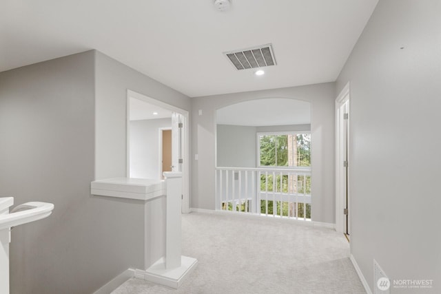 4952 160th Ct SE, Bellevue, WA 98006 - corridor with carpet, visible vents, baseboards, and arched walkways