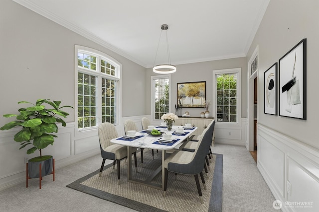 4952 160th Ct SE, Bellevue, WA 98006 - dining room featuring light carpet, a decorative wall, crown molding, and a wainscoted wall