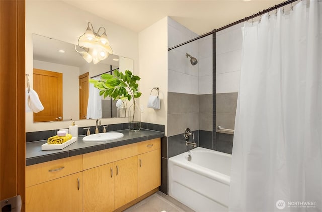 bathroom with tile patterned floors, shower / bath combination with curtain, and vanity