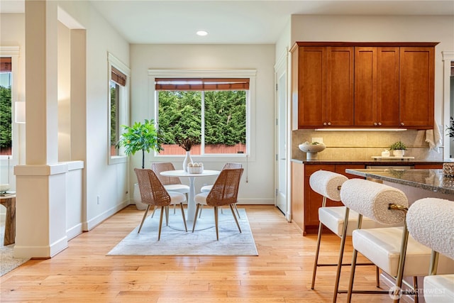 17288 NE 120th Way, Redmond, WA 98052 - dining room featuring baseboards, light wood-type flooring, and recessed lighting