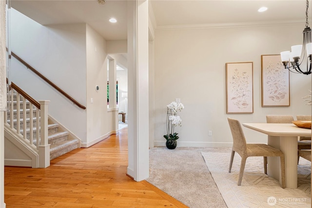 17288 NE 120th Way, Redmond, WA 98052 - dining area featuring crown molding, baseboards, stairs, and a notable chandelier