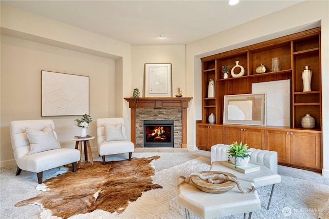 17288 NE 120th Way, Redmond, WA 98052 - living area with built in features, baseboards, a fireplace, and light colored carpet
