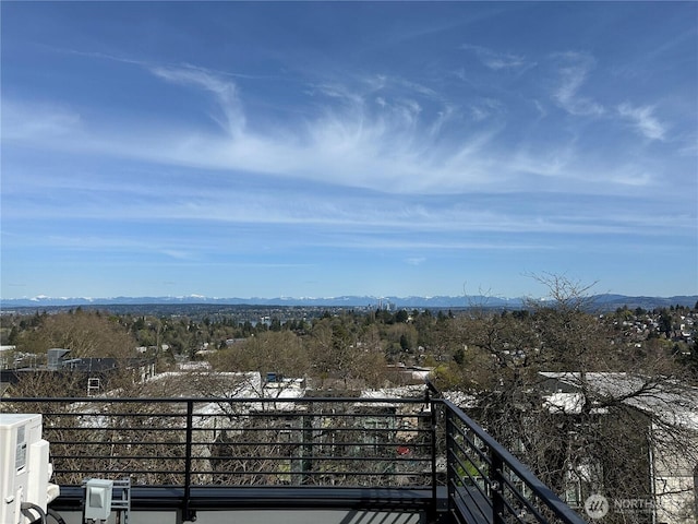 balcony featuring a mountain view