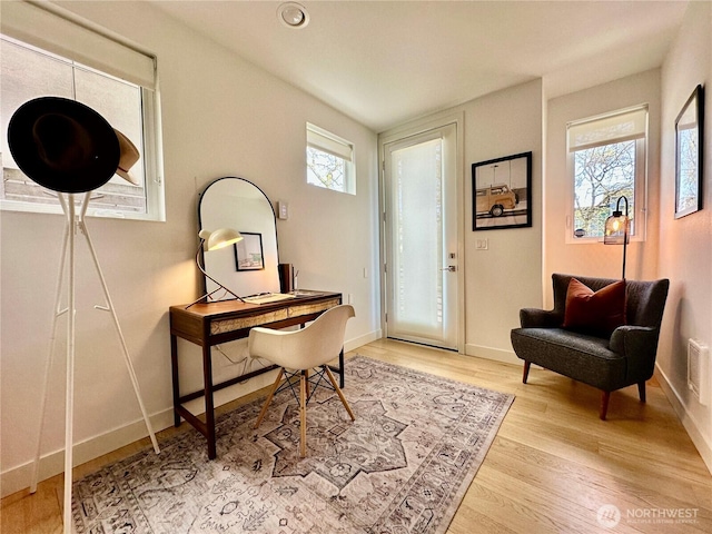 office with visible vents, light wood finished floors, and baseboards