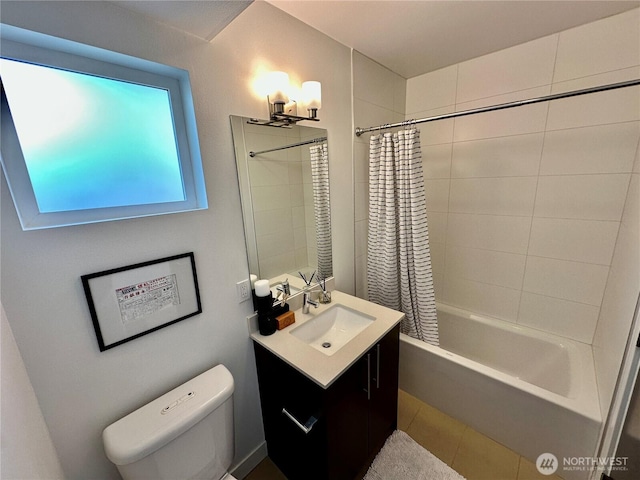 full bathroom with shower / bath combo with shower curtain, tile patterned flooring, toilet, and vanity