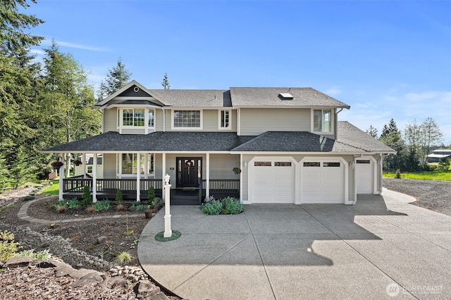 309 Cousins Rd, Chehalis, WA 98532 - view of front facade featuring a porch, an attached garage, a shingled roof, and driveway