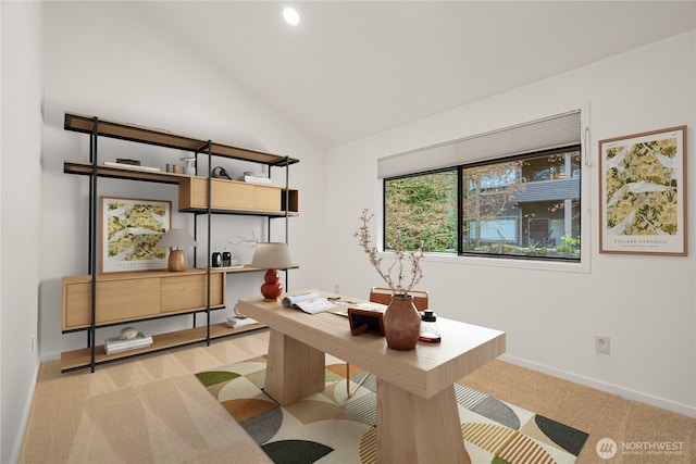 office with carpet floors, vaulted ceiling, and baseboards