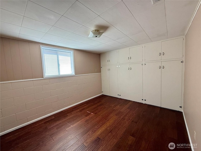 818 E Spring St, Dayton, WA 99328 - unfurnished bedroom featuring dark wood-style flooring
