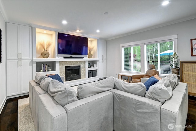 501 125th Ave NE, Lake Stevens, WA 98258 - living area featuring crown molding, recessed lighting, a stone fireplace, and dark wood-type flooring