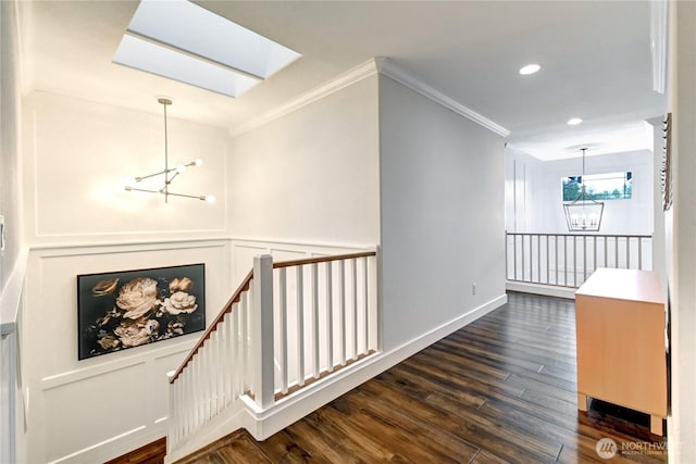 501 125th Ave NE, Lake Stevens, WA 98258 - corridor with crown molding, an upstairs landing, dark wood-style flooring, and a notable chandelier