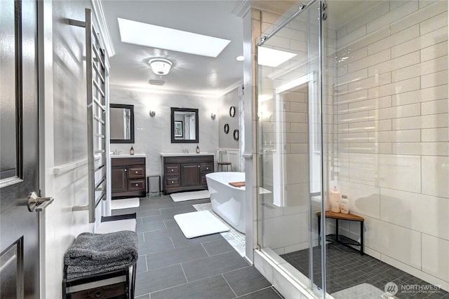 501 125th Ave NE, Lake Stevens, WA 98258 - bathroom featuring crown molding, vanity, tile patterned flooring, and a stall shower