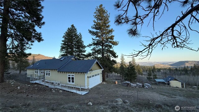 view of side of property featuring a mountain view
