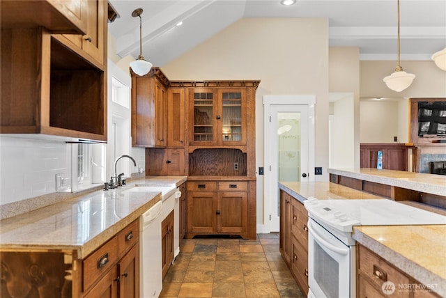 44 Alpine Ln, Okanogan, WA 98840 - kitchen featuring white appliances, brown cabinets, backsplash, pendant lighting, and vaulted ceiling