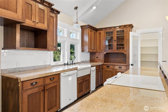 44 Alpine Ln, Okanogan, WA 98840 - kitchen featuring dishwasher, brown cabinets, backsplash, a sink, and range