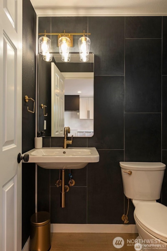 bathroom with toilet and a sink