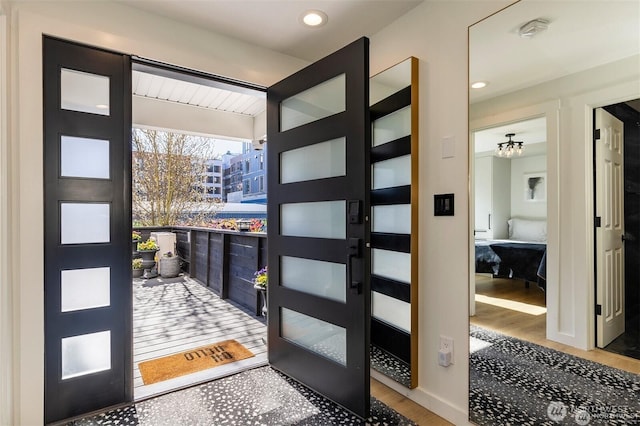 foyer entrance featuring wood finished floors and recessed lighting