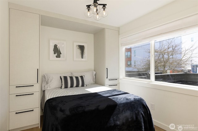 bedroom featuring a chandelier
