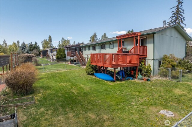 back of property featuring a yard, a fenced backyard, stairs, and a deck