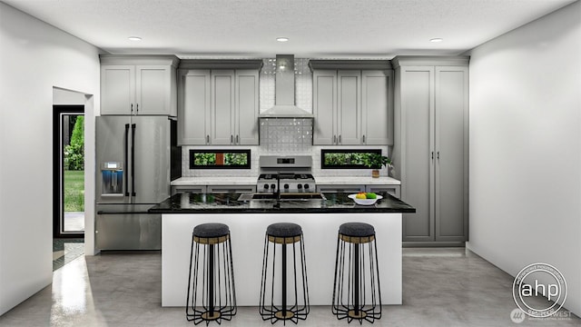 191XX Church Lake Rd E, Bonney Lake, WA 98391 - kitchen with stainless steel appliances, finished concrete floors, wall chimney exhaust hood, decorative backsplash, and a kitchen island