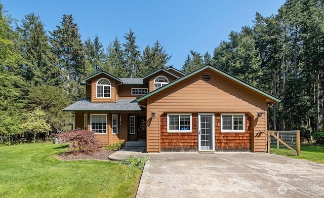 rustic home with a porch, a front yard, and a shingled roof