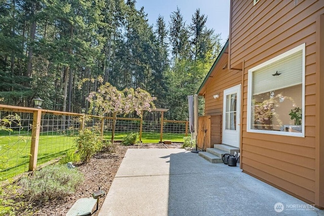 view of patio / terrace featuring fence and entry steps