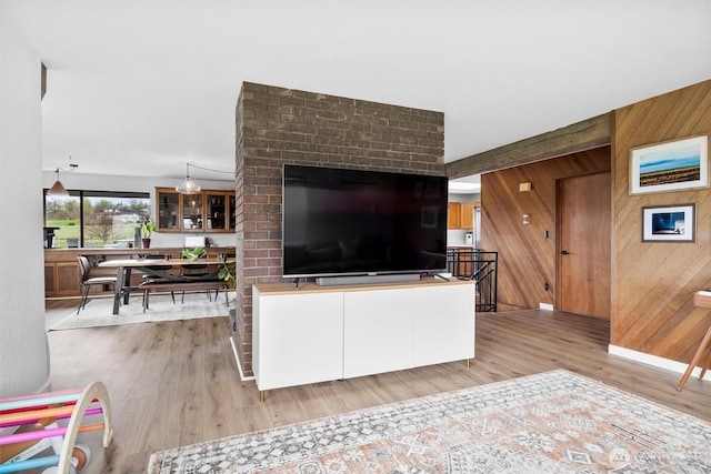 5752 Ronnie Hill Ln, Ferndale, WA 98248 - living room with wooden walls and light wood-style floors