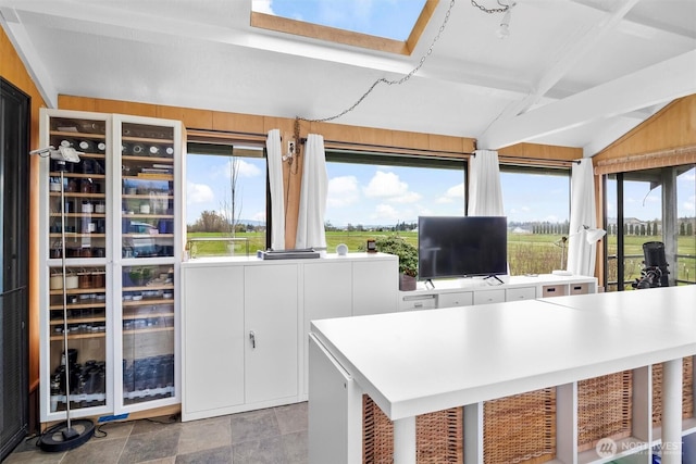 5752 Ronnie Hill Ln, Ferndale, WA 98248 - home office with lofted ceiling with beams and stone finish flooring