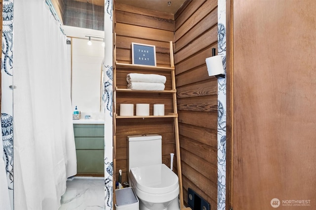 5752 Ronnie Hill Ln, Ferndale, WA 98248 - full bath with marble finish floor, toilet, and a shower with shower curtain