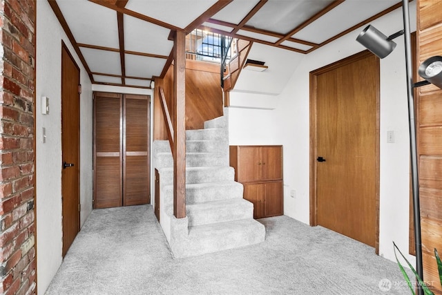 5752 Ronnie Hill Ln, Ferndale, WA 98248 - stairway featuring brick wall and carpet