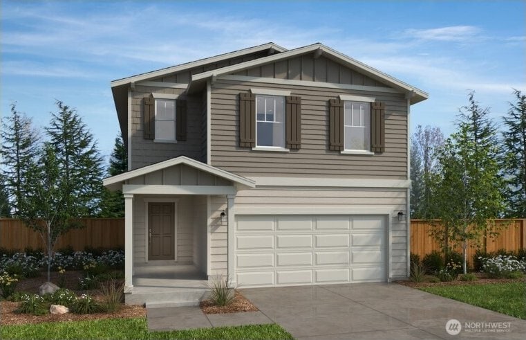 traditional-style house featuring board and batten siding, fence, driveway, and a garage