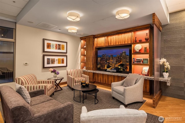 home theater room featuring wood finished floors