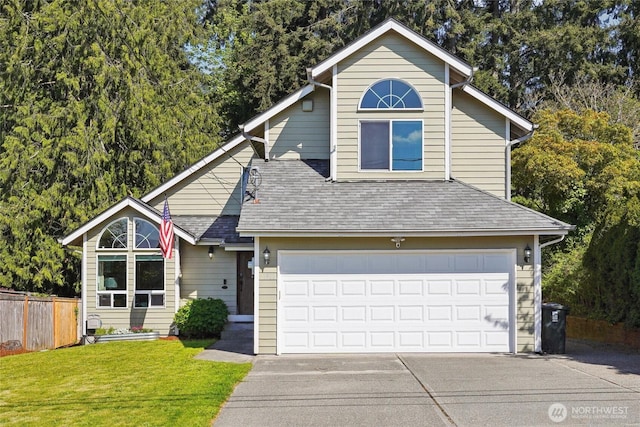 view of front of home featuring a garage, fence, a front lawn, concrete driveway, and a shingled roof