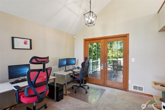 carpeted office featuring baseboards, visible vents, french doors, and lofted ceiling