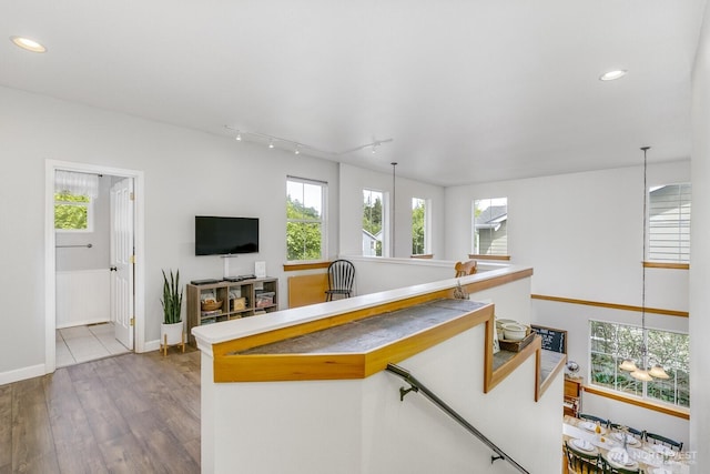 6426 128th Pl SE, Snohomish, WA 98296 - living room featuring wood finished floors, rail lighting, plenty of natural light, recessed lighting, and baseboards