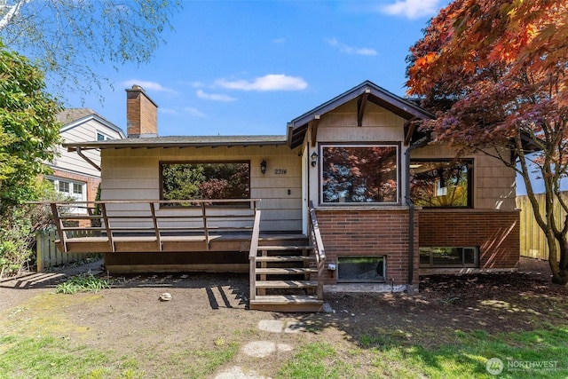 view of front of house featuring a chimney